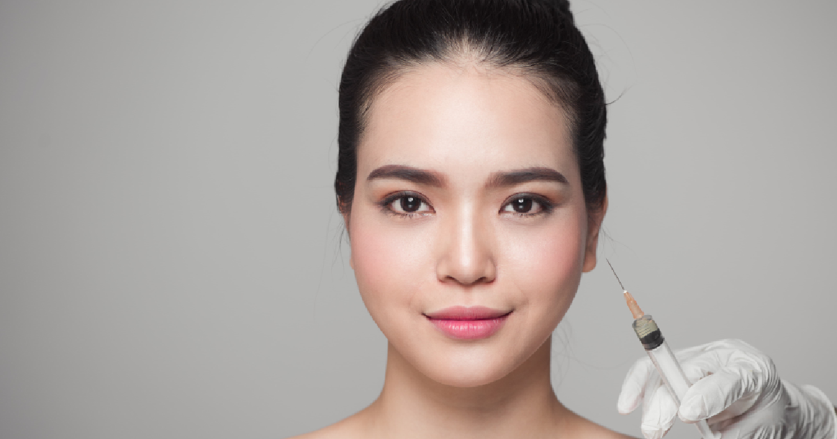 Woman receiving dermal filler injections with a syringe in Hickory, NC